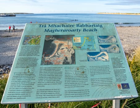 MAGHEROARTY, IRELAND - JULY 31 2022: Sign explaining the area