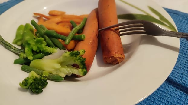 food sausages, sweet potatoes, broccoli. High quality photo