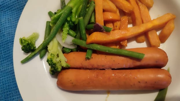 food sausages, sweet potatoes, broccoli. High quality photo
