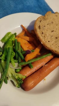 food sausages, sweet potatoes, broccoli. High quality photo