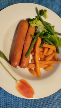 food sausages, sweet potatoes, broccoli. High quality photo