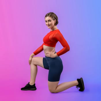 Full body length gaiety shot athletic and sporty young woman in fitness exercise posture on isolated background. Healthy active and body care lifestyle.