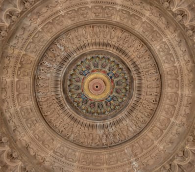 London, UK - Feb 27, 2024 - Elaborate ceiling design of intricately carved stone interior of The Shree Sanatan Hindu Mandir Hindu Temple. Look up, Copy space, Selective focus.