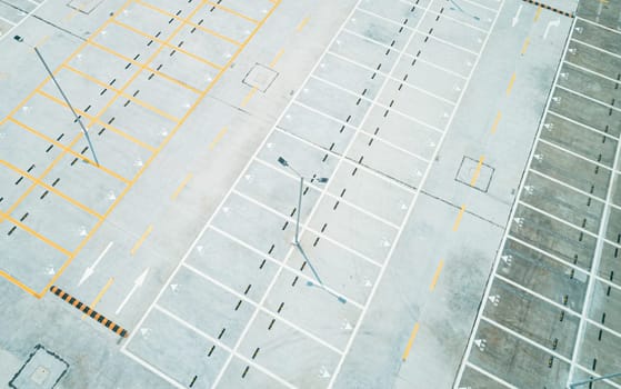 Aerial high angle shot of an empty car parking lot