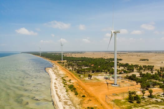 Aerial drone of Wind turbines producing clean sustainable energy, clean energy future. Wind power plant. Jaffna, Sri Lanka.