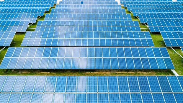 Aerial view of Solar Panels Farm Solar Cell Station. Production of clean energy. Renewable green alternative energy concept.