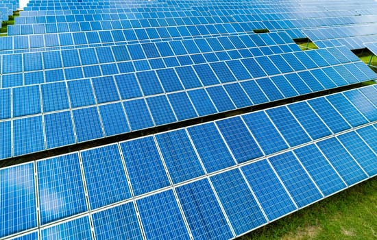 Aerial view of Solar Panels Farm Solar Cell Station. Production of clean energy. Renewable green alternative energy concept.