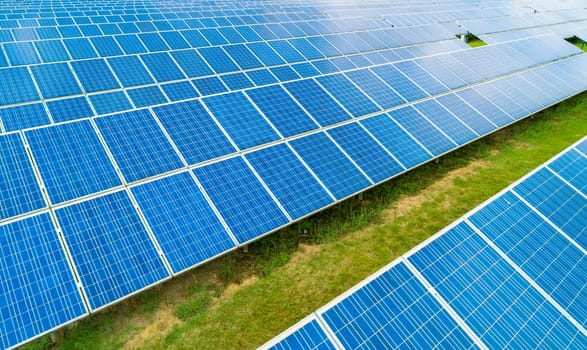 Aerial view of Solar Panels Farm Solar Cell Station. Production of clean energy. Renewable green alternative energy concept.