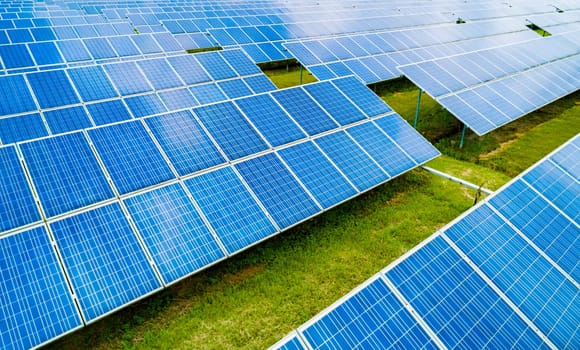 Aerial view of Solar Panels Farm Solar Cell Station. Production of clean energy. Renewable green alternative energy concept.