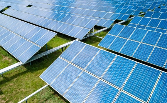 Aerial view of Solar Panels Farm Solar Cell Station. Production of clean energy. Renewable green alternative energy concept.