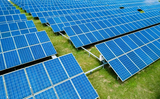 Aerial view of Solar Panels Farm Solar Cell Station. Production of clean energy. Renewable green alternative energy concept.