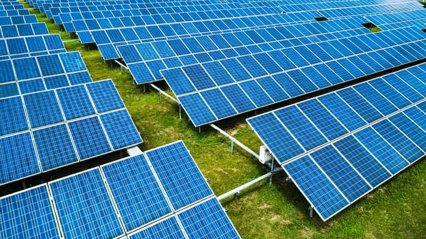 Aerial view of Solar Panels Farm Solar Cell Station. Production of clean energy. Renewable green alternative energy concept.