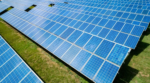 Aerial view of Solar Panels Farm Solar Cell Station. Production of clean energy. Renewable green alternative energy concept.