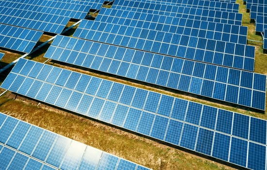 Aerial view of Solar Panels Farm Solar Cell Station. Production of clean energy. Renewable green alternative energy concept.