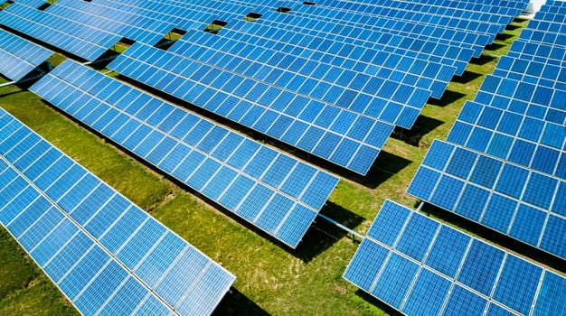 Aerial view of Solar Panels Farm Solar Cell Station. Production of clean energy. Renewable green alternative energy concept.