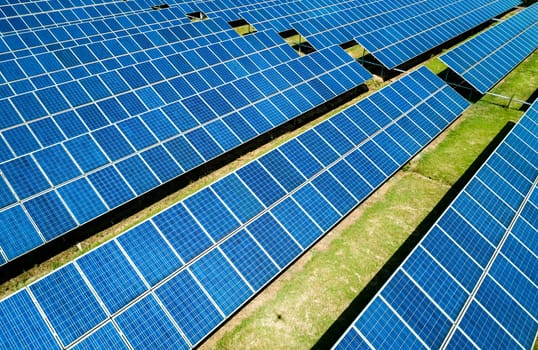 Aerial view of Solar Panels Farm Solar Cell Station. Production of clean energy. Renewable green alternative energy concept.