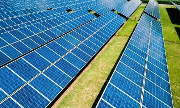 Aerial view of Solar Panels Farm Solar Cell Station. Production of clean energy. Renewable green alternative energy concept.