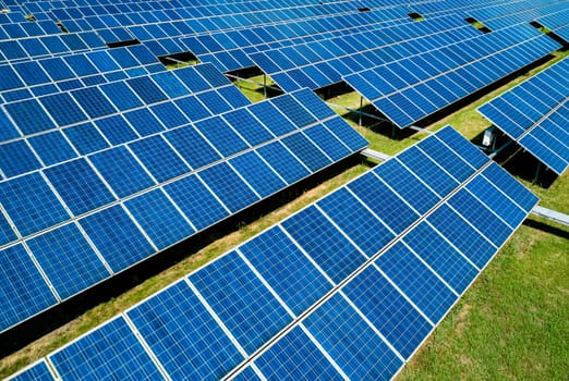 Aerial view of Solar Panels Farm Solar Cell Station. Production of clean energy. Renewable green alternative energy concept.