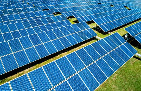 Aerial view of Solar Panels Farm Solar Cell Station. Production of clean energy. Renewable green alternative energy concept.