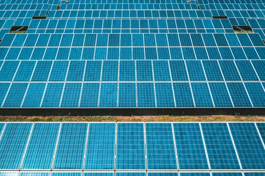 Aerial view of Solar Panels Farm Solar Cell Station. Production of clean energy. Renewable green alternative energy concept.