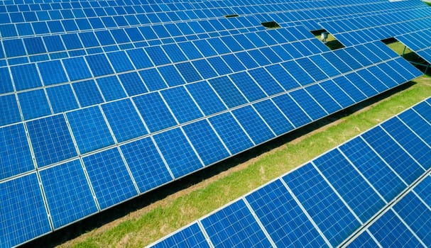 Aerial view of Solar Panels Farm Solar Cell Station. Production of clean energy. Renewable green alternative energy concept.