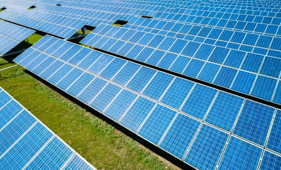 Aerial view of Solar Panels Farm Solar Cell Station. Production of clean energy. Renewable green alternative energy concept.