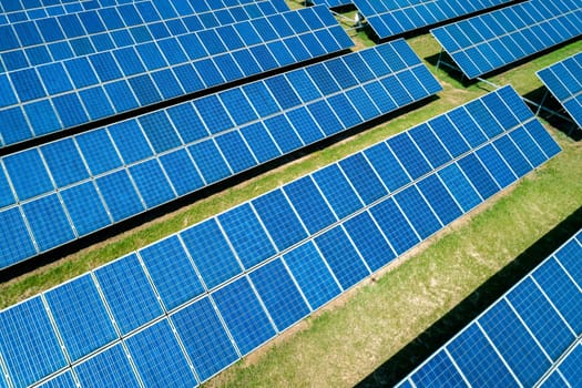 Aerial view of Solar Panels Farm Solar Cell Station. Production of clean energy. Renewable green alternative energy concept.