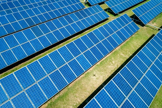 Aerial view of Solar Panels Farm Solar Cell Station. Production of clean energy. Renewable green alternative energy concept.