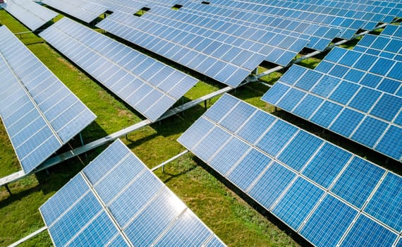 Aerial view of Solar Panels Farm Solar Cell Station. Production of clean energy. Renewable green alternative energy concept.