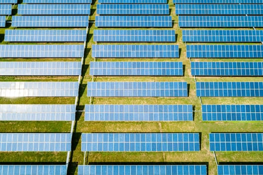 Aerial view of Solar Panels Farm Solar Cell Station. Production of clean energy. Renewable green alternative energy concept.