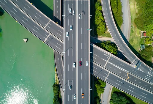 Aerial drone view of highway multi-level junction road with moving cars. China. The concept of the urban.