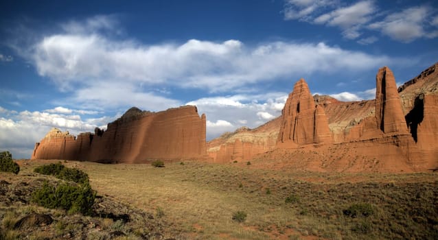 The light from a setting sun casts on Cathedral Valley at Capitol Reef National Park, Utah