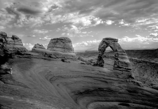 Delicate Arch stands prominent during threatening skies at Arches National Park, Utah