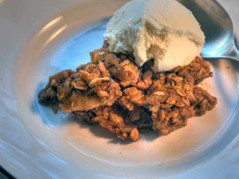 Side View of Vanilla Ice cream on apple crisp