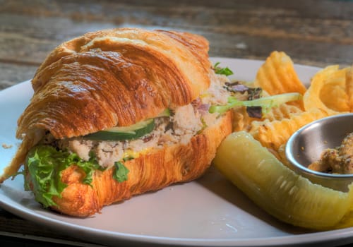 Side View of Chicken Salad Croissant Sandwhich