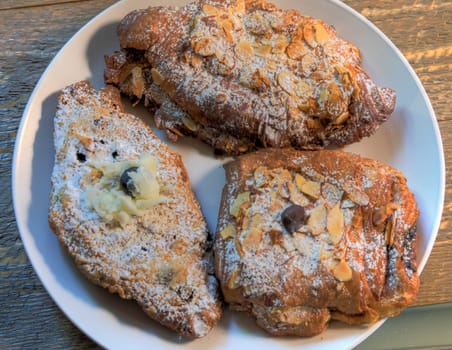Top View Breakfast Croissants on a natural wood surface