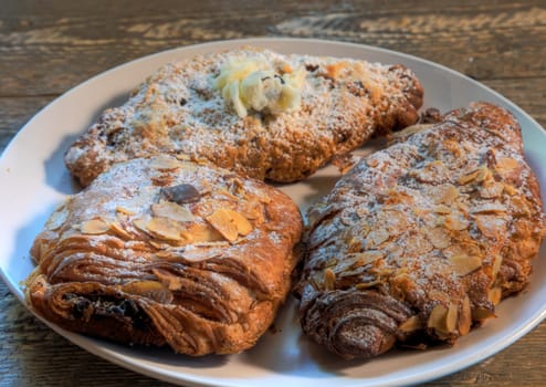 Side View of Breakfast Croissants on a natural wood surface