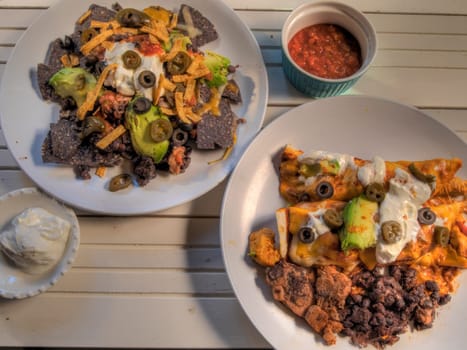 Top view of nachos and Chicken Enchikadas