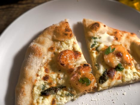 Side view of barbeque shrimp pizza