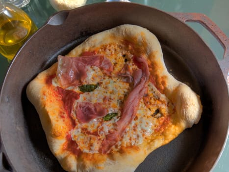 Top View of Prosciotto Pizza in Cast Iron Skillet