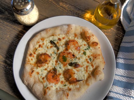 Top view of barbeques shrimp pizza