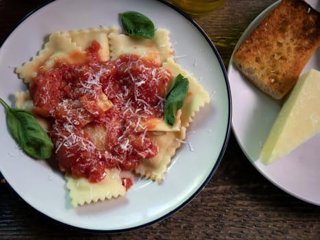 Top view of  Ravioli dinner on natural wood surface