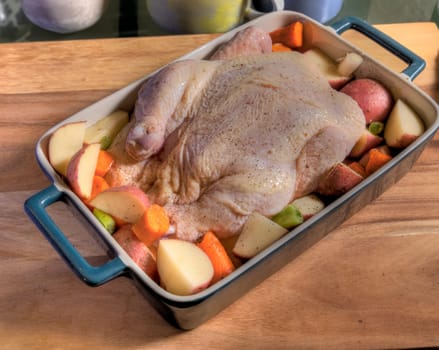 Top View Raw Whole Chicken On Butcher Block Surface