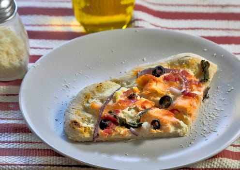 Slices of Smoked Salmon Pizza fresh out of the oven 