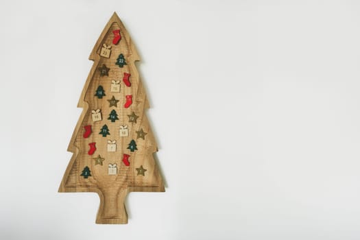 Wooden Christmas tree with hanging 24 numbers Advent calendar