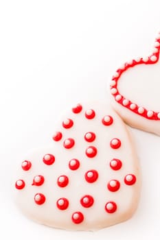 Gourtmet heart shaped cookies decorated for Valentine's Day.