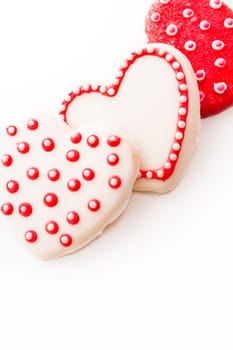 Gourtmet heart shaped cookies decorated for Valentine's Day.