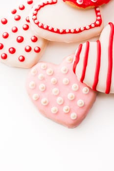 Gourtmet heart shaped cookies decorated for Valentine's Day.