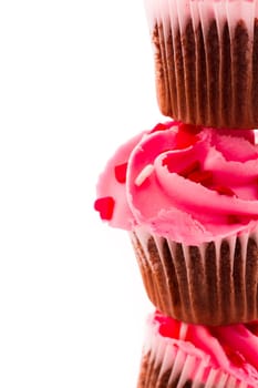 Stack of pink cupcakes on white background.