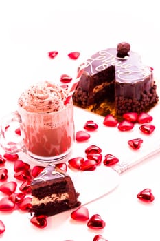 Heart shaped salted caramel cake on white background.